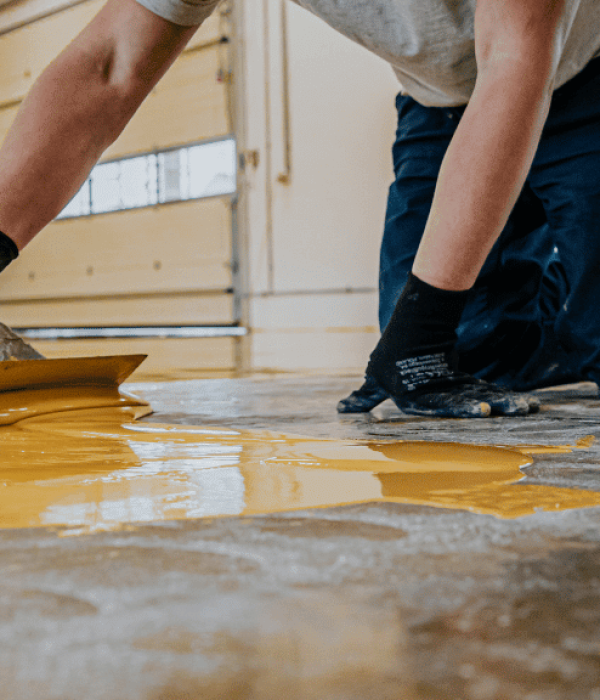 contractor installing epoxy flooring